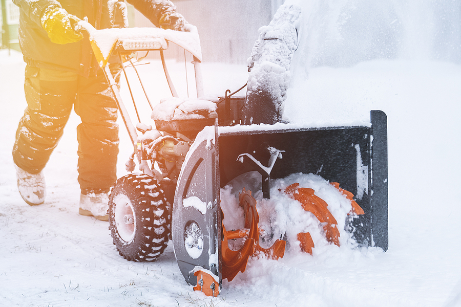 A Man Removes Snow With A Snow Plow After A Heavy Snowfall